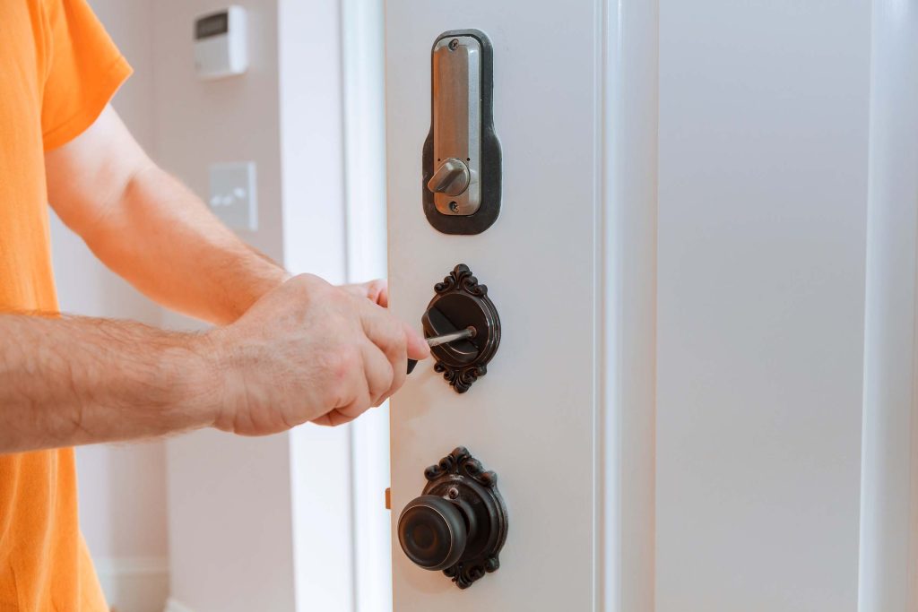 closeup-of-a-professional-locksmith-installing-or-PPQML3L-1024x683